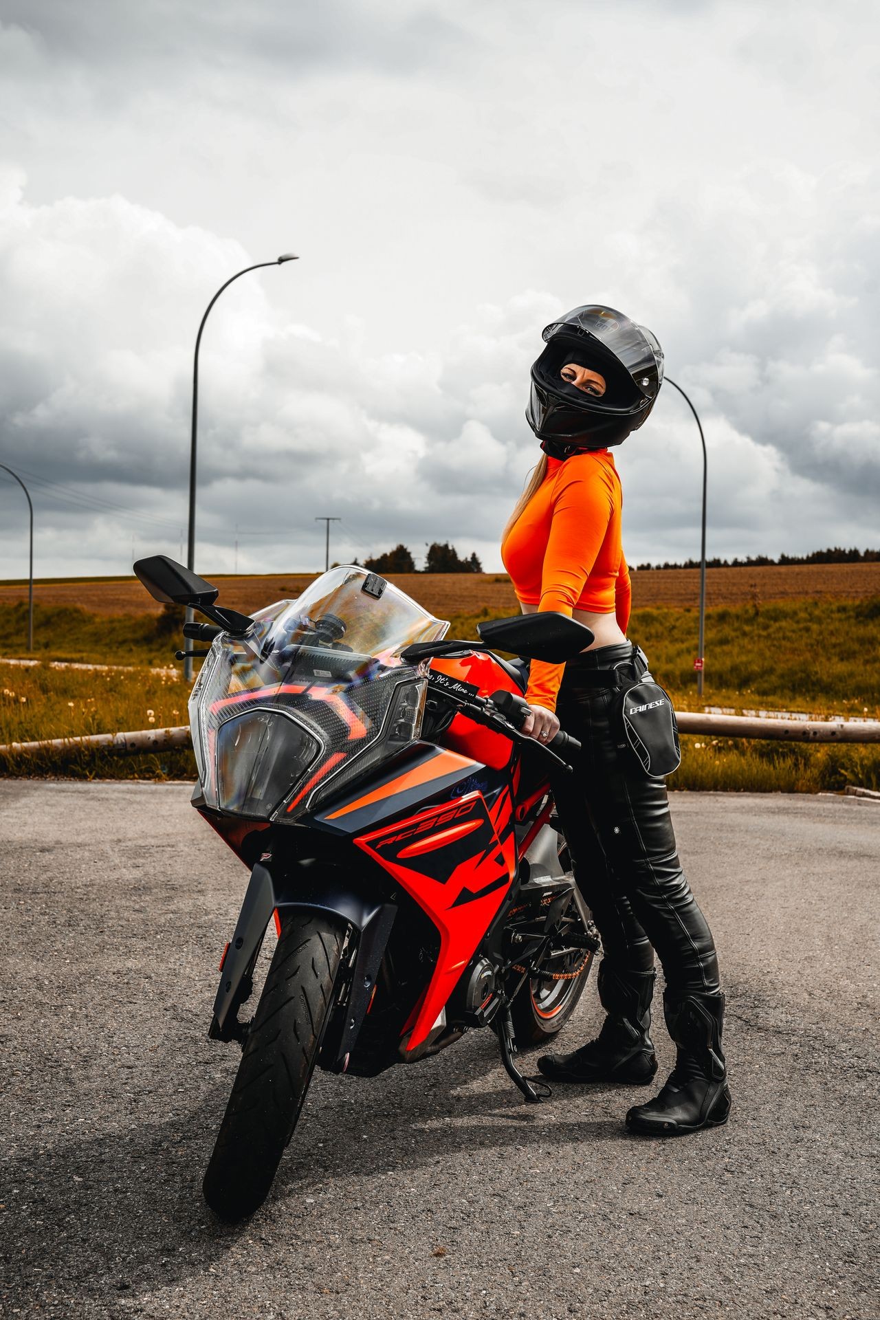 photo of girl next to motorcycle